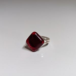 Ruby red hand crafted glass diamond shaped ring. Silver plated adjustable.